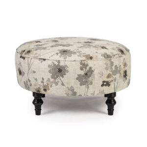 round renae ottoman in modern floral fabric with turned legs